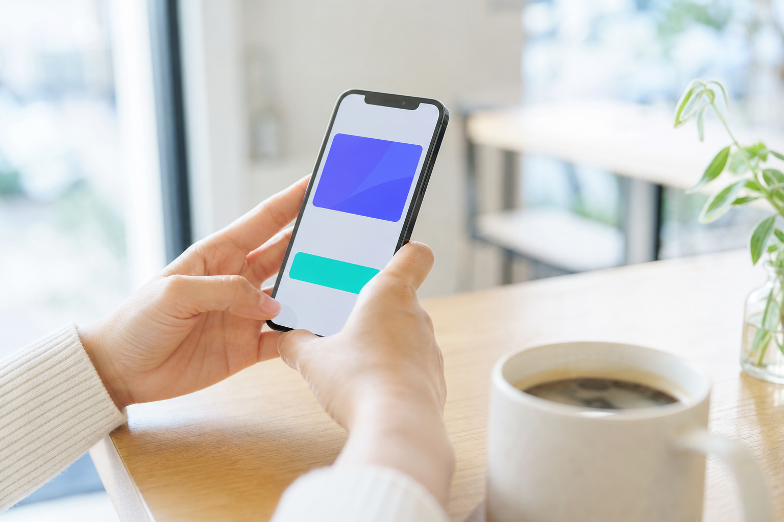 カフェでスマートフォンのLINEミニアプリ会員カード画面を操作する手元